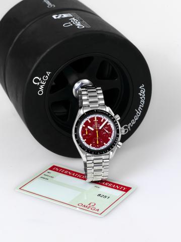 RACING.Omega, Speedmaster, Automatic, case No. 55329582.Ref. 381061. Made circa 1996..Fine, asymmetric, self-winding, water-resistant, stainless.steel wristwatch with round button chronograph, registers.tachometer and a stainless steel Omega bracelet with