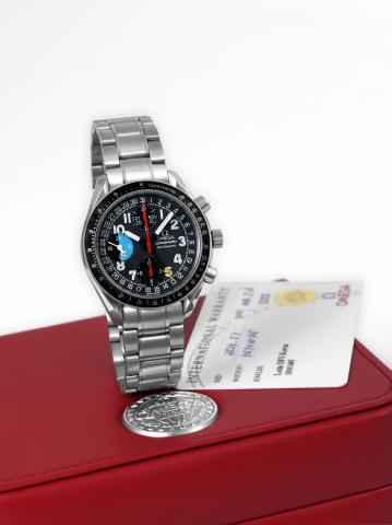 Day-Date.Omega, Speedmaster, Automatic, case No. 56703046.Ref. 3520.53. Sold on July 13th, 2004..Fine, asymmetric, self-winding, water-resistant, stainless.steel wristwatch with round button chronograph, registers.triple date and 24 hour indication, tacho