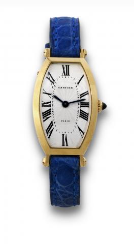Cartier, Paris, Cintr_e Along_e, case No. 12 VIII, Ref. A105340..Very fine, tonneau shaped, curved, 18K yellow gold lady