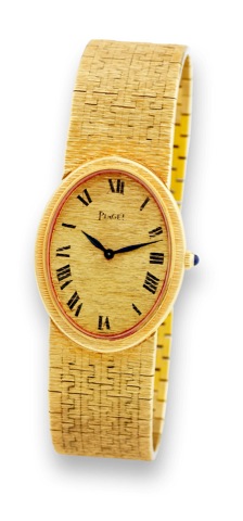 Piaget - Yellow Gold.Piaget, case No. 147786, Ref. 9861. Made in the 1980s..Fine, oval, 18K yellow gold mid-size wristwatch with an.integral 18K yellow gold textured bracelet. Accompanied by.a box.