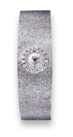Piaget White Gold and Diamonds.Piaget, movement No. 651612, case No. 109798, Ref. 2301..Made circa 1970..Fine, 18K white gold and diamond-set lady's wristwatch with.an integral 18K bark-finish white gold Piaget bracelet.