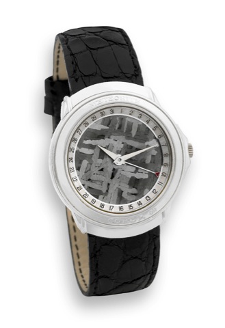 Corum - Platinum - Meteorite Dial.Corum, Meteorite, case No. 525969, Ref. 50450.70, No. 156..Made in the late 1990s..Very fine, rare and interesting, thin, self-winding, waterresistant.platinum wristwatch with date, meteorite dial and a.platinum Corum buc