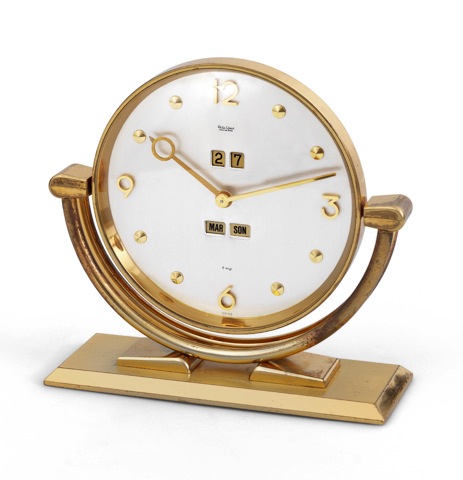 Philip Watch Calendar.Desk Clock.Philip Watch, Chaux-de-Fonds, Swiss..Made for the German market, circa 1960..Fine, gilt brass, 8-day going desk clock.with triple-date calendar and alarm.