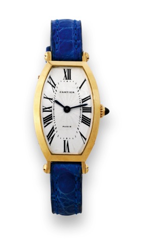 Cartier, Paris, Cintr_e Along_e.case No. 12 VIII, Ref. A105340..Very fine, tonneau shaped, curved.18K yellow gold lady