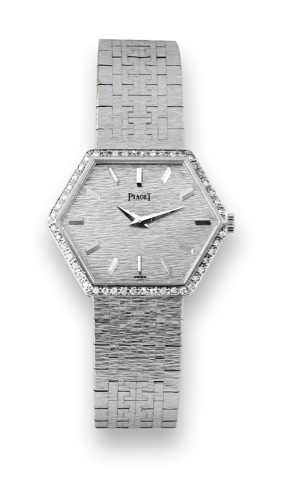 Piaget White Gold & Diamonds.Piaget, case No. 304284, Ref. 95575 A6. Made in the 1970s..Fine, hexagonal, 18K white gold, lady's wristwatch with.diamond-set bezel and an integral 18K white gold Piaget.bracelet. Accompanied by a Piaget box.