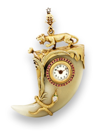 Griffe de Tigre _ Gold.Diamond and Ruby.Pendant Watch.Probably Paris. Made circa 1910..Very fine, exotic and elegant, yellow.gold, tiger