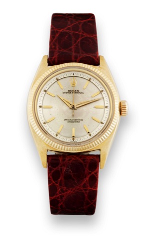 Rolex Ref. 6502- Yellow Gold.Rolex, Oyster Perpetual, Officially Certified Chronometer.case No. 540378, Ref. 6502. Made circa 1959..Fine and rare, tonneau-shaped, center-seconds, self winding.water-resistant, 18K yellow gold wristwatch with a gold.plated 