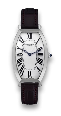 Cartier Platinum Tonneau Cintr_e.Cartier Paris, Tonneau Cintr_e, No. 0053 AF, Ref. 2435 E..Made circa 2000..Fine, tonneau-shaped, curved platinum wristwatch with an.18K white gold Cartier deployant clasp.