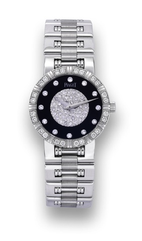 Piaget Onyx & Diamonds.Piaget, case No. 647197, Ref. 9000564. Made in the 1990's..Very fine, thin and elegant, 18K white gold and diamond-set lady