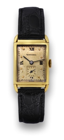 Longines Yellow Gold.Longines, movement No. 7153899.case No. 81494. Made in the 1940's..Fine and rare, rectangular curved.14K yellow gold wristwatch..To be sold without reserve
