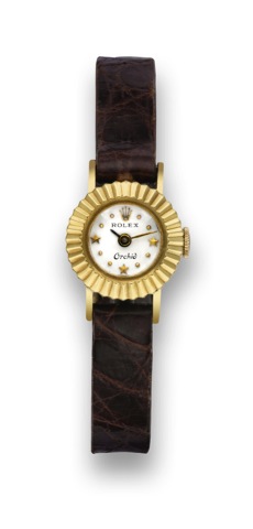 Rolex - Orchid _ Star dial.Rolex, Orchid, case No. 407617, Ref. 8792. Made in the 1960's..Fine, 18K yellow gold lady's wristwatch with star indexes..To be sold without reserve