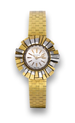 Jaeger Lecoultre White.and Yellow Gold Flower.Jaeger LeCoultre, No. 1563883, case.No. 881589, Ref. 1679. Made circa 1950..Fine and elegant, 18k yellow and white.gold lady's wristwatch with an integral.18K yellow bracelet..To be sold without reserve
