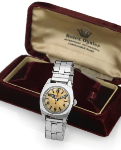 ROLEX - REF. 4070 ARMY.Rolex Oyster, Army, No. 207844, Ref. 4070. Made in.the 1940's..Fine and unusual, cushion-cased, center-seconds, waterresistant.stainless steel wristwatch with expanding rivet.bracelet. Accompanied by original fitted box and guarante