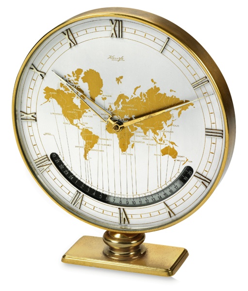 KIENZLE WORLD TIME CLOCK.Kienzle. Made circa 1960..Large world time, 8-day going desk clock with 24-hour day.and night indication.To be sold without reserve