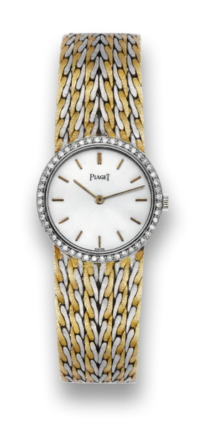 PIAGET WHITE GOLD, YELLOW GOLD.AND DIAMONDS.Piaget, No. 667765, case No. 127564, Ref. 925 E 47. Made in.the 1970's..Fine, 18K white gold, 18K yellow gold and diamond-set lady's.wristwatch with an integral bark-finished 18K white gold and.18K yellow gold P
