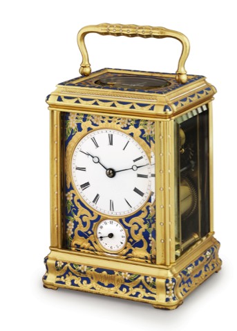 DROCOURT CHAMPLEVE ENAMEL.CARRIAGE CLOCK.Drocourt, No. 7561. Made in France, circa 1880..Fine, gilt brass and champlev_ enamel, 8-day going, hour and.half-hour striking carriage clock with repeat and alarm.