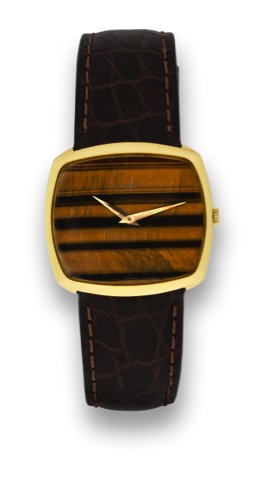 PIAGET, REF. 9731, YELLOW GOLD, TIGER EYE DIAL.Piaget, movement No. 7514072, case No. 212398, Ref. 9731. Made in the 1980's..Very fine and elegant, 18K yellow gold wristwatch with tiger eye dial and a gold plated Piaget buckle.