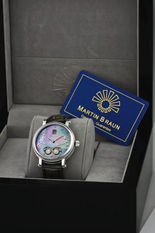 MARTIN BRAUN, REF. 42/MOP - DIA, EOS.MOTHER-OF-PEARL DIAL.Martin Braun, Ref. 42/MOP - DIA, No. 002. Made circa 2006..Fine and unusual, self-winding, water-resistant, stainless steel.wristwatch with sunrise/sunset indication, date and a stainless.steel Mar
