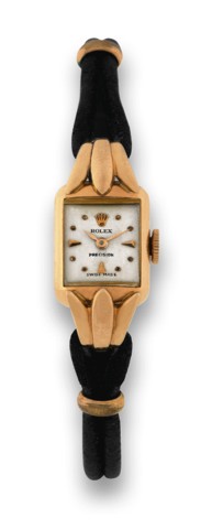 ROLEX REF. 4567 PINK GOLD.Rolex, Precision, case No. 484660, Ref. 4567. Made in.the 1940's..Very fine and rare, rectangular, 18K pink gold lady's.wristwatch on a black cord..To be sold without reserve