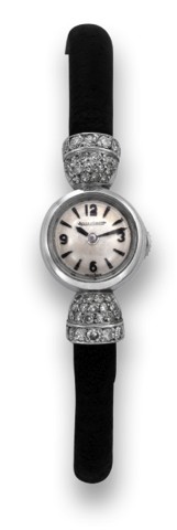 JAEGER LECOULTRE WHITE GOLD AND DIAMONDS.Jaeger-LeCoultre, case No. 64399A. Made in the 1960s..Fine and elegant, 18K white gold lady's back-wind wristwatch with diamond set shoulders and 18k white gold.buckle.