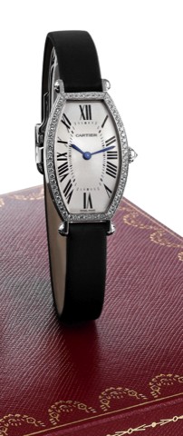 CARTIER TONNEAU CINTREE WHITE GOLD AND.DIAMOND.Cartier, Paris, Tonneau Cintr_e, No. 21753NX, Ref. 2711..Made circa 2000..Fine and elegant, tonneau-shaped, curved, 18K white gold.and diamond-set lady's wristwatch with an 18K white gold.Cartier deployant cl