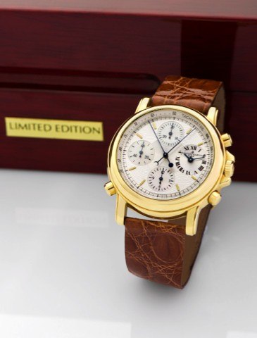ULYSSE NARDIN, REF. 571-22, YELLOW.GOLD SPLIT - CHRONO BERLIN 1907.Ulysse Nardin, No. 055, Ref. No. 571-22..Made circa 1995..Very fine, self-winding, water-resistant.18K yellow gold wristwatch with round.button split-seconds chronograph.registers, tachome
