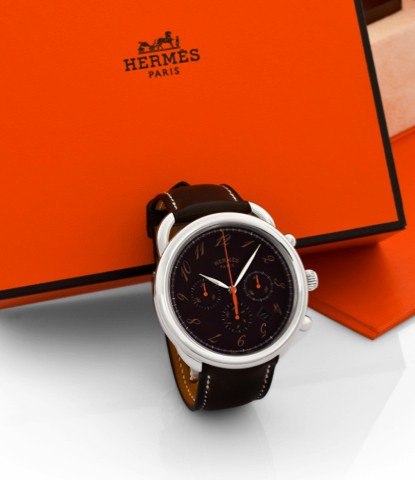 HERMÈS ARCEAU, REF. AR4.910.CHRONOGRAPH EBÈNE.Hermès, Paris, Arceau Chronographe.ébène, No. 2675767, Ref. AR4.910. Sold on.March 17th, 2010..Fine, large, self-winding, water-resistant.stainless steel wristwatch with roundbutton.chronograph, registers, dat