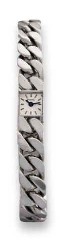 PIAGET REF. 1001, WHITE.GOLD BAGUETTE.Piaget, White Gold Baguette Duo-plan.Movement, case No. 138094, Ref. 1001.N 10. Made in the 1960s..Very fine, very small and elegant, heavy.18K white gold lady's wristwatch with an.integral 18K white gold articulated 