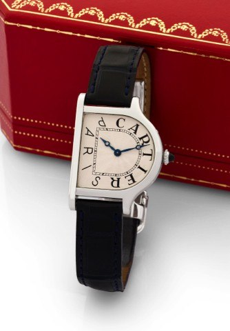 CARTIER UNIQUE PLATINUM CLOCHE.Cartier, Paris, Cloche, No. 1/1, case no A112949. Made.by Cartier in 1996 specially for the thematic auction The.Magical Art of Cartier..Extremely fine, elegant and thin, unique, bell-shaped.asymmetrical platinum wristwatch 
