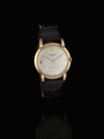 PATEK PHILIPPE REF. 2420 PINK GOLD.Patek Philippe, Genève, No. 951839, case No. 421451.Ref. 2420. Made in 1948, sold February 15th, 1949..Fine and rare, 18K pink gold wristwatch with an 18K pink.gold Patek Philippe buckle. Accompanied by the Extract from.