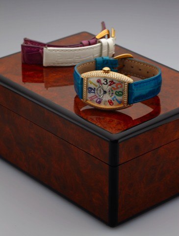 FRANCK MULLER REF. 7502 QZD COLOR DREAMS.GOLD & DIAMONDS.Franck Muller, Genève, Curvex, No. 307, Ref. 7502 QZD..Made circa 2000..Fine, tonneau-shaped and curved, water-resistant, 18K.yellow gold and diamonds quartz wristwatch with an 18K.yellow gold Franc