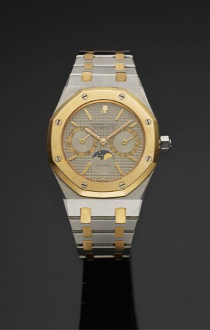 AUDEMARS PIGUET ROYAL OAK DAY & DATE.RETAILED BY TIFFANY STEEL & GOLD.Audemars Piguet, Royal Oak - Day and Date, Moon Phases.Automatic, No. 1280. Made in the 1990's..Very fine, tonneau-shaped, astronomic, self-winding, waterresistant.stainless steel and 1