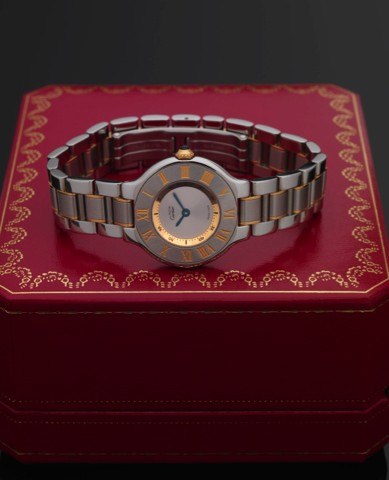 CARTIER REF. 1340 MUST 21 STEEL & GOLD.Cartier, No. PL326189, Ref. 1340. Made in 2005, sold.November 10th, 2006..Fine, stainless steel and yellow gold, water-resistant, quartz.wristwatch with an integral stainless steel and yellow.gold link bracelet with 