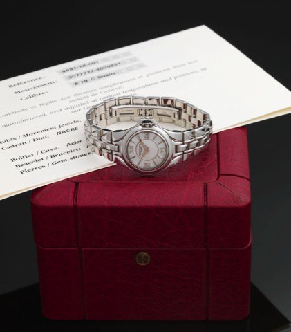 PATEK PHILIPPE REF. 4891 MOTHER OF PEARL.STEEL.Patek Philippe, Genève, Sculpture, No. 3077727, case No..4005831, Ref. 4891/1. Made in 1999..Fine and rare, water-resistant, stainless steel quartz.wristwatch with date and an integrated, stainless steel.Pate