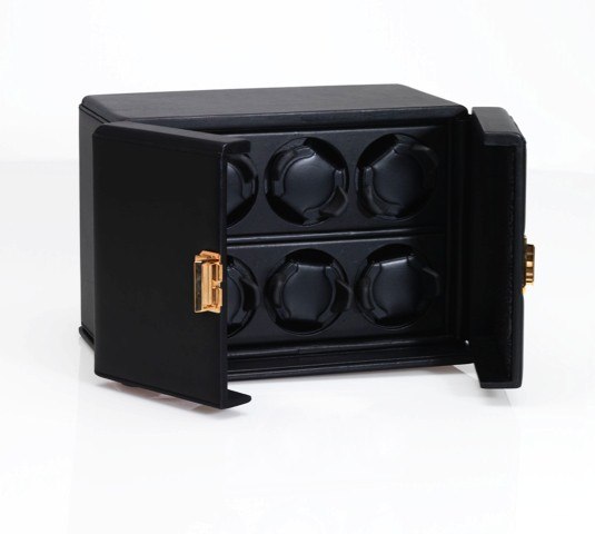 SCATOLA DEL TEMPO SIX WATCH WINDING BOX.Scatola Del Tempo, Milan, Model 6RT. Sold on April 25th.2004. Accompanied by the original outer box, certificate.instructions and dealer's guarantee card..To be sold without reserve