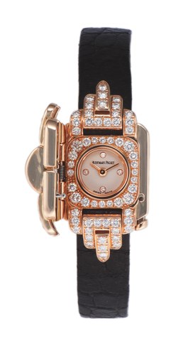 AUDEMARS PIGUET REF.67195/OR.CONCEALED DIAL LADY’S PINK GOLD.AND DIAMOND.Audemars Piguet, Geneve, No. E01368, Ref. 67195/.OR. Sold on March 26, 2004..Elegant 18K pink gold and diamonds watch with.concealed dial and an 18K pink gold buckle set.with diamond