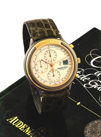 Audemars Piguet Chrono Tantale.Audemars Piguet, Automatic, movement No..347905, case No. C62593, Ref. TR 25644. Made in.the 1990’s..Fine and unusual, self-winding, tantale and.18K yellow gold wristwatch with round button.chronograph, registers, tachometer