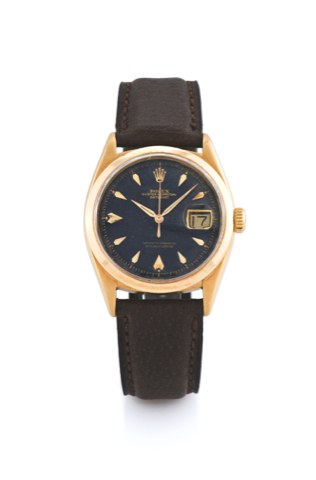 Yellow Gold, Ref. 6604 Rolex, Oyster.Perpetual DateJust, Superlative Chronometer.Officiall y Certified.Case No. 283006, Ref. 6604. Made in 1957..Fine and rare, early, tonneau-shaped, center seconds, selfwinding.waterresistant, 18K yellow gold wristwatch w