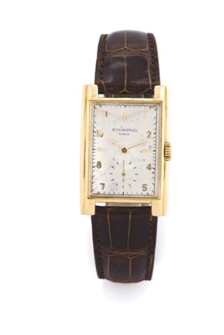 Patek Philippe Ref. 1570.Patek Philippe & Cie, Genève, No. 838768, case No. 642122, ref. 1560. made circa 1952..Very fine and rare, large, rectangular curved, 18K yellow gold wristwatch with an 18k.yellow gold patek philippe buckle.
