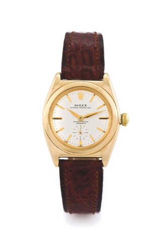 ROLEX BUBBLE YELLOW GOLD.Rolex, Oyster Perpetual, Officially Certified Chronometer.No. 52xxxx (partially erased), Ref. No. erased. Made circa 1940..Fine, tonneau-shaped, center seconds, self-winding, water resistant.18k yellow gold wristwatch with a yello