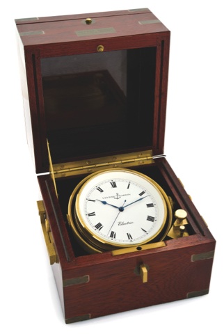 ULYSSE NARDIN ELECTRIC MARINE.CHRONOMETER.Ulysse Nardin, Le Locle, Suisse, movement No. 010497..Made in the 1970s..Fine, mahogany brass-bound marine lever chronometer.with center-seconds and electric remontoire..To be sold without reserve