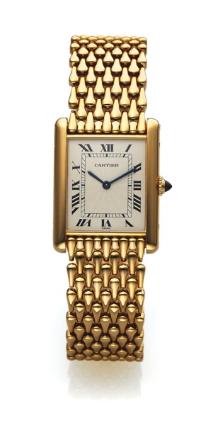 CARTIER TANK MECANIQUE YELLOW GOLD.Cartier, Paris, Tank, case No. C33055, Ref. 16121. Made in.the 1990s..Very fine, rectangular, thin, 18K yellow gold wristwatch.with an 18k yellow gold Cartier mesh link bracelet with.double deployant clasp.