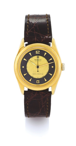 ROLEX REF 6082 TWO-TONE DIAL.Rolex Oyster Shock Resisting, movement No. 16410, case No. 784933, Ref. 6082. Made circa 1951..Fine and rare, center seconds, water-resistant, gold plated and stainless steel wristwatch with a gold-plated Rolex buck