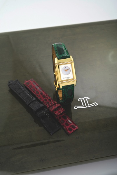 JAEGER LECOULTRE REVERSO DUETTO JOAILLERIE.Jaeger-LeCoultre, Reverso Duetto Ref. 266.1.44. Made circa 2006..Fine, rectangular, 18K yellow gold and diamond lady’s reversible double-dial wristwatch with an 18K yellow gold deployant clasp. Accompa