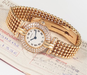 CARTIER REF. 2132 RIVOLI. YELLOW GOLD & DIAMONDS. Cartier Paris, ‘’Rivoli’’, case No. 8057911. Sold on April 13th. 1996.. Very fine, round, 18K yellow gold and diamond lady’s quartz. wristwatch with an 18K yellow gold Cartier fancy beaded. bracelet with d