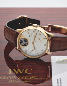 IWC PORTUGUESE TOURBILLON MYSTERE PINK GOLD. International Watch Co., Schaffhausen, “Portuguese. Tourbillon Mystère,” No. 198 / 250, case No. 3133265, Ref.. 5042. Made in a limited edition of 250 pieces in 2005.. Very fine and rare, large, self-winding, w