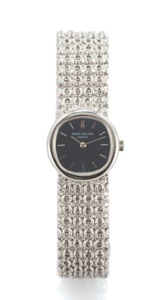 PATEK PHILIPPE REF. 4188 2 WHITE GOLD. Patek Philippe, Genève, No. 1261244, case No. 522876. Ref. 4188 2. Made circa 1975.. Fine and elegant, oval, 18K white gold lady’s wristwatch. with an integral 18K white gold Patek Philippe bracelet.