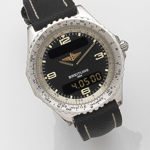 Chronospace, Ref:A56011, Case No.0228, Circa 1995 7-jewel quartz movement, charcoal grey dial with luminous baton hour markers and Arabic quarters, white outer minute divisions, raised black outer tachymeter scale on polished ground, matt gilt pointed bat