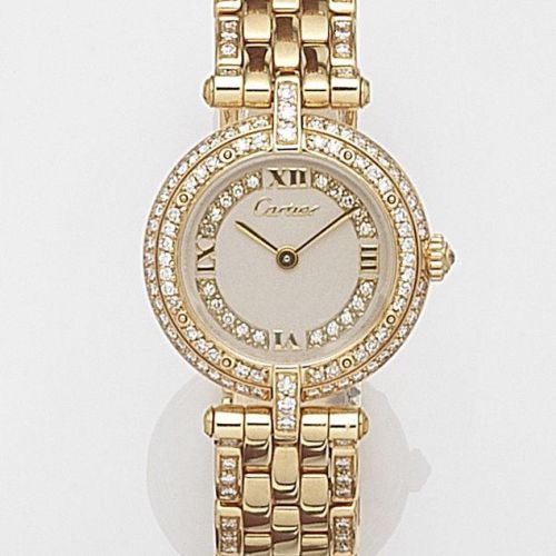 Cartier. A lady's 18ct gold and diamond set quartz bracelet watch