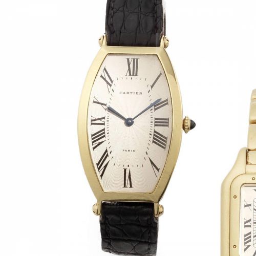 Cartier. An 18ct gold manual wind tonneau shaped wristwatch